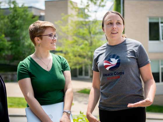 two students talking outdoors